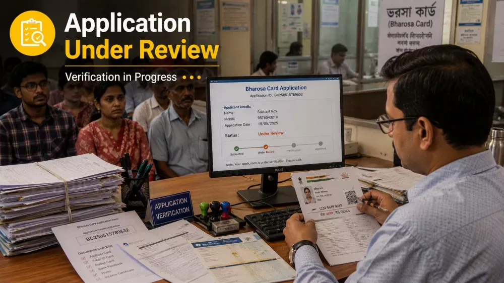 Government official reviewing Bharosa Card application documents