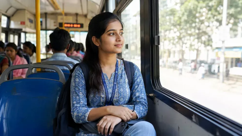 College student travelling free on a government bus in West Bengal